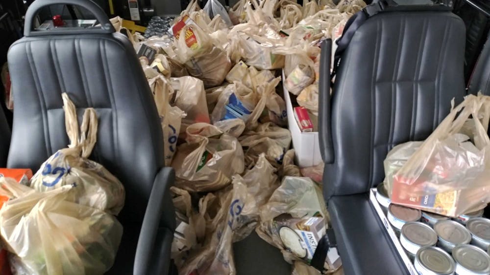Bags full of food sit inside of a bus during Agency 10 on Aging&#x27;s Stuff-A-Bus event in December 2019. The food goes to support the agency&#x27;s food pantry for homebound seniors. 