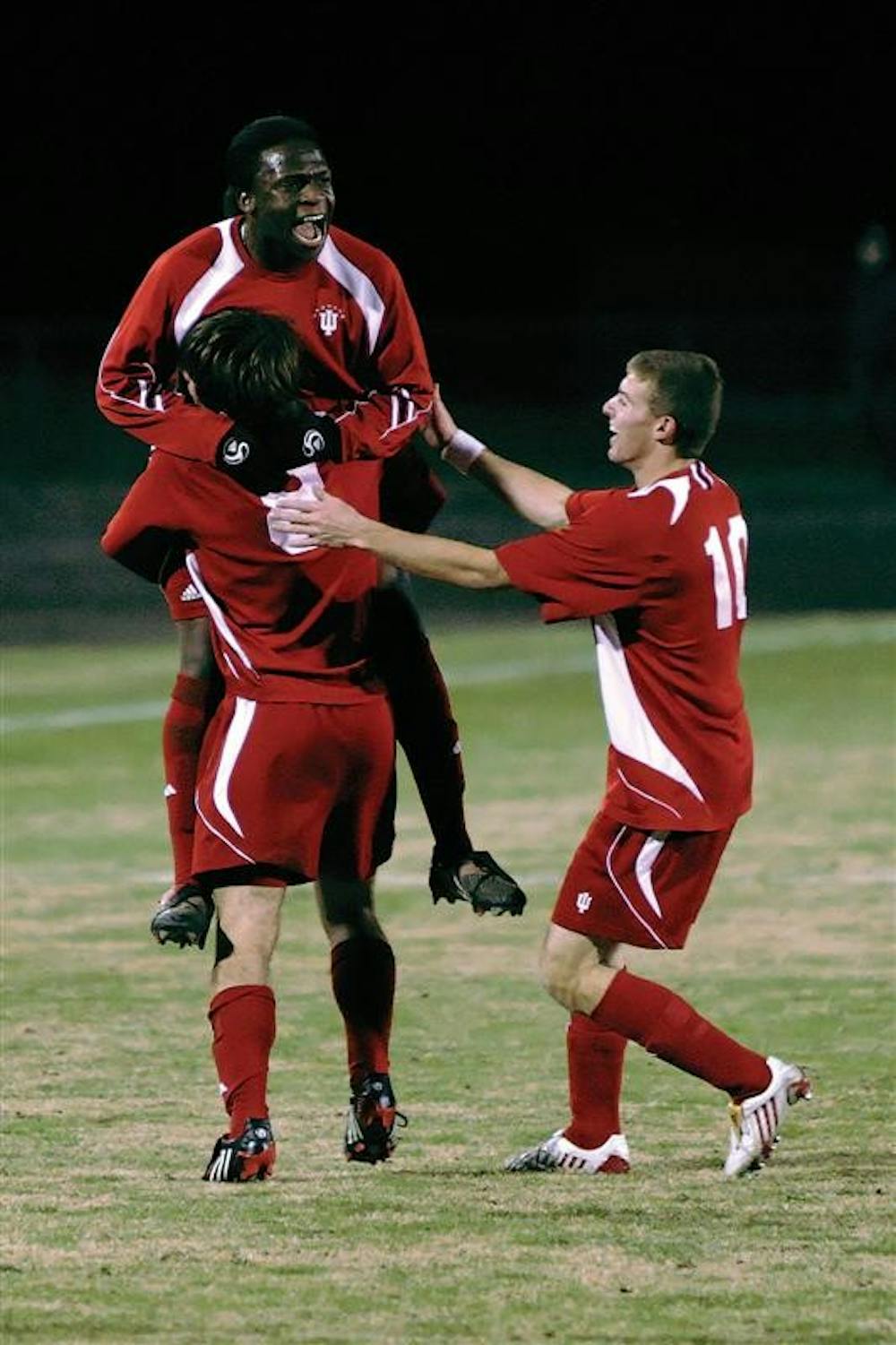 Senior midfielder John Mellencamp (8) celebrates with teammates Ofori Sarkodie and Andy Adlard (10) following Mellencamp's goal in the 18th minute of the Hoosier's 2-0 win over St. Louis on Tuesday night at Bill Armstrong Stadium. IU advances to the third round of the NCAA tournament where the team will play host to Michigan at 7 p.m. Saturday.