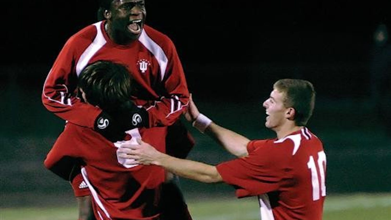 Senior midfielder John Mellencamp (8) celebrates with teammates Ofori Sarkodie and Andy Adlard (10) following Mellencamp's goal in the 18th minute of the Hoosier's 2-0 win over St. Louis on Tuesday night at Bill Armstrong Stadium. IU advances to the third round of the NCAA tournament where the team will play host to Michigan at 7 p.m. Saturday.