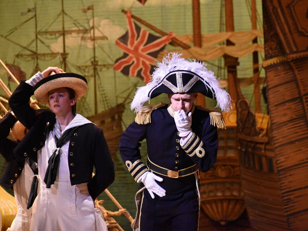 Andrew Durham reacts to an actor on stage in &quot;H.M.S. Pinafore.&quot; Durham plays Captain Corcoran, the captain of the Pinafore.