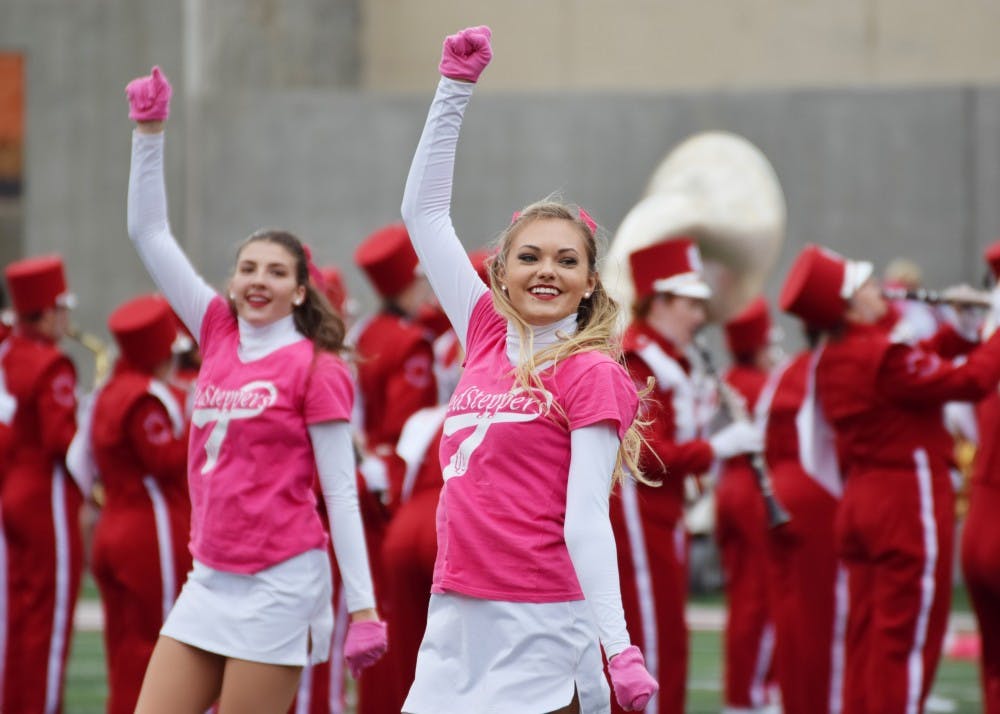 Cheerleaders begin the game by getting the student section to cheer along with them at the game against Charleston Southern on Oct. 7. IU's cheerleaders play a central role during Homecoming week festivities.&nbsp;