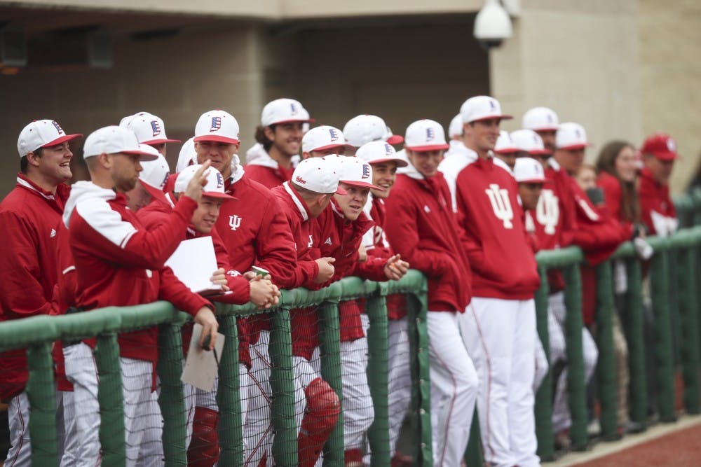 <p>The IU dugout watches an IU at-bat during the game against Indiana State on April 10 at Bart Kaufman Field.&nbsp;</p>