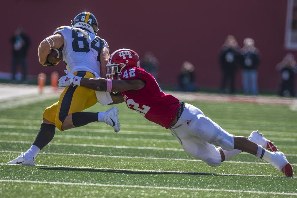 <p>Sophomore defensive back Marcelino Ball attempts to tackle senior Iowa wide receiver Nick Easley during the homecoming game Oct. 13, 2018 at Memorial Stadium. IU homecoming games have been a beloved tradition among students and alumni for decades.</p>
