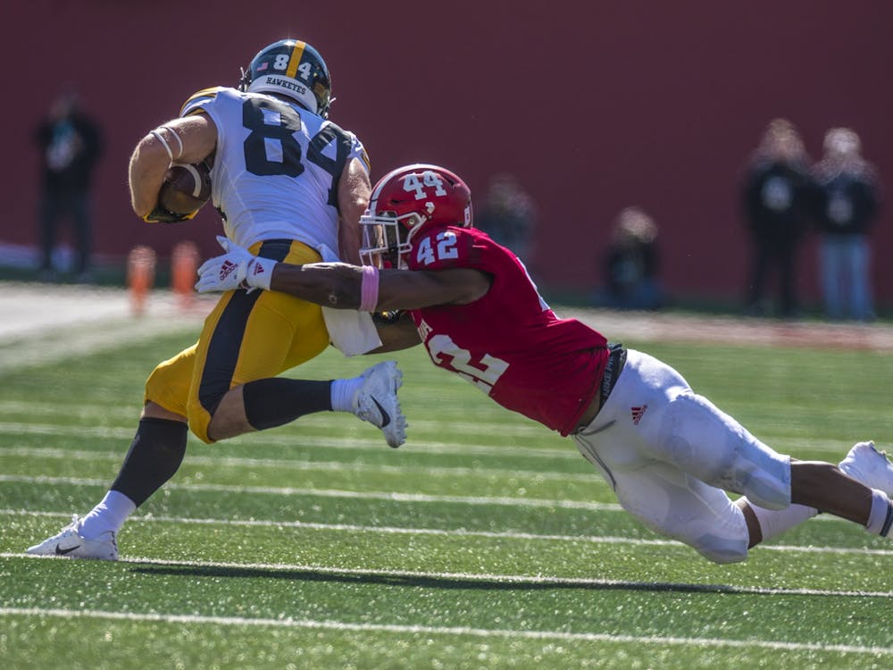 Sophomore defensive back Marcelino Ball attempts to tackle senior Iowa wide receiver Nick Easley during the homecoming game Oct. 13, 2018 at Memorial Stadium. IU homecoming games have been a beloved tradition among students and alumni for decades.