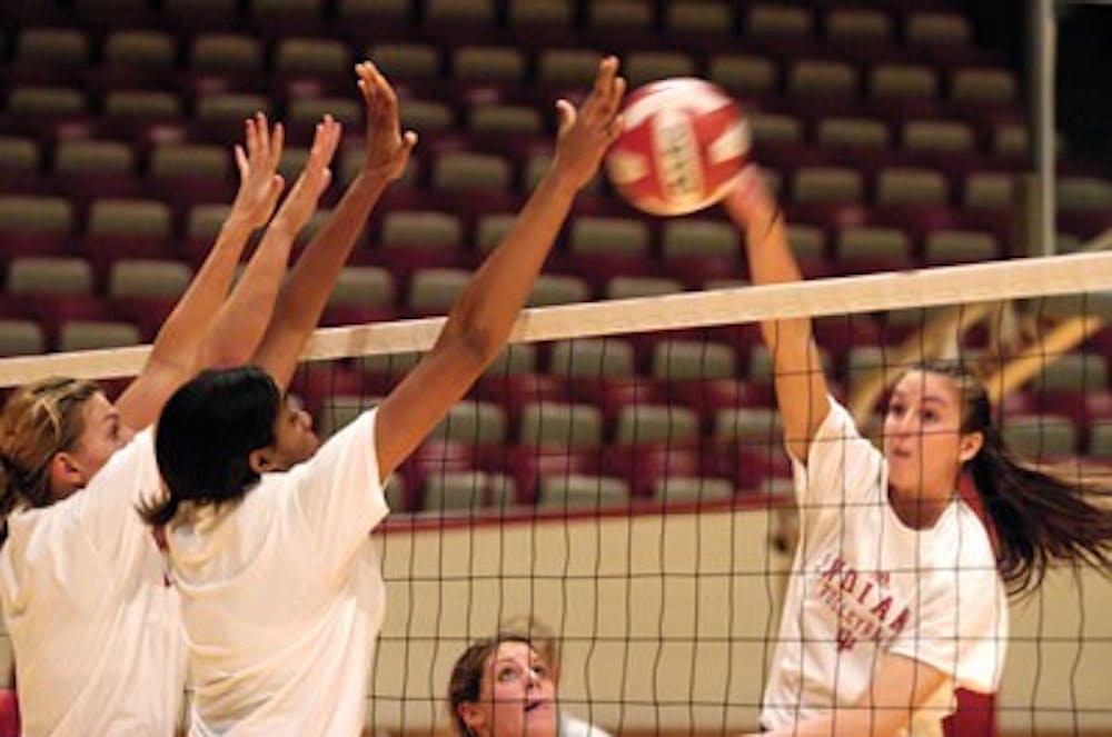 Members of the volleyball team practice Thursday at Assembly Hall.