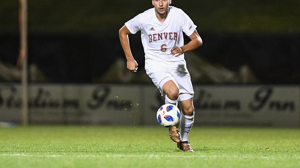 Callum Stretch dribbles the ball across the field. Stretch announced his transfer to IU from the University of Denver for his junior season in mid-March.