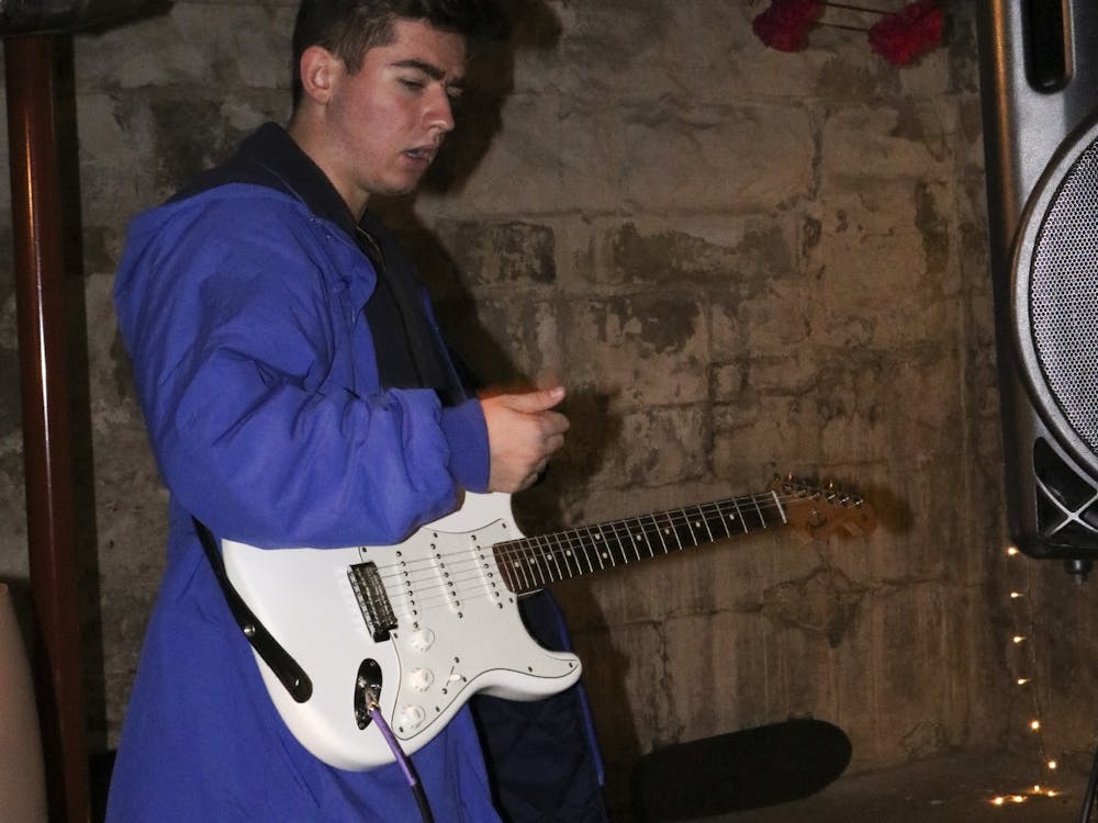 Freshman Ahnay Hering plays the guitar during the jam on Nov. 13, 2021, in Bloomington. Hering has been involved with music for a while, he just released his first Extended Play on various streaming services.