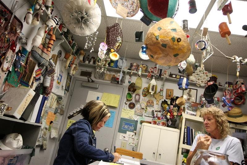 Fawnya Arvin, left, fills out paperwork with Reuse Coordinator Mary Kay Baker, right, to acquire material for arts and crafts on Oct. 9 from the Monroe County Recycling Center's Reuse Center. The Reuse Center is open for walk-in's every Thursday, and provides free materials to many schools and organizations. 