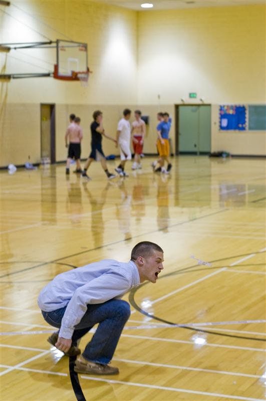 Junior Eric Hutland tries to catch his paper airplane for creativity Thursday evening at the Health Physical Education and Recreation Building. Several students competed in the Red Bull Paper Wings contest for a chance to win a trip to Europe.