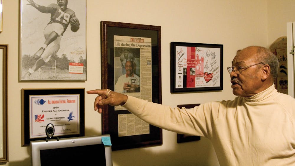 George Taliaferro points to his recognitions and awards on the wall in his Bloomington home in 2007. Big Ten commissioner Kevin Warren announced the creation of the George and Viola Taliaferro Scholarship on Thursday. 