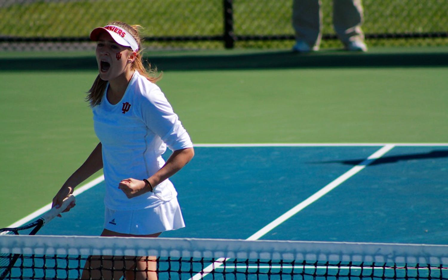 Sophomore Natalie Whalen cheers after scoring a point in a doubles match against Illinois&nbsp;Friday afternoon. The Hoosiers fell against the Fighting Illini., 6-1.&nbsp;