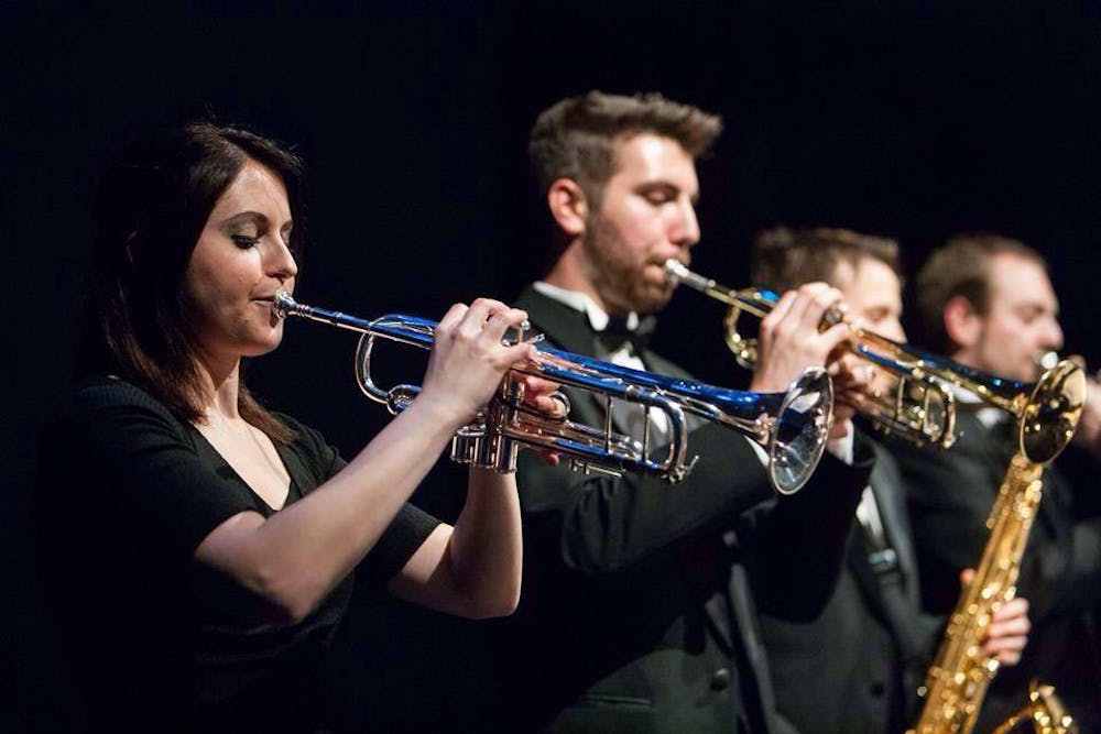 Jess Henry, left, director of the All-Campus Jazz Ensemble. The ensemble is a traditional big band that is open to non-music majors.