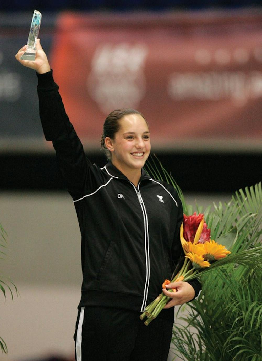 Christina Loukas waves to the crowd after she received her award for winning the women's 3-meter springboard at the U.S. Olympic diving trials in Indianapolis, Saturday, June 21, 2008.  (AP Photo/Michael Conroy)