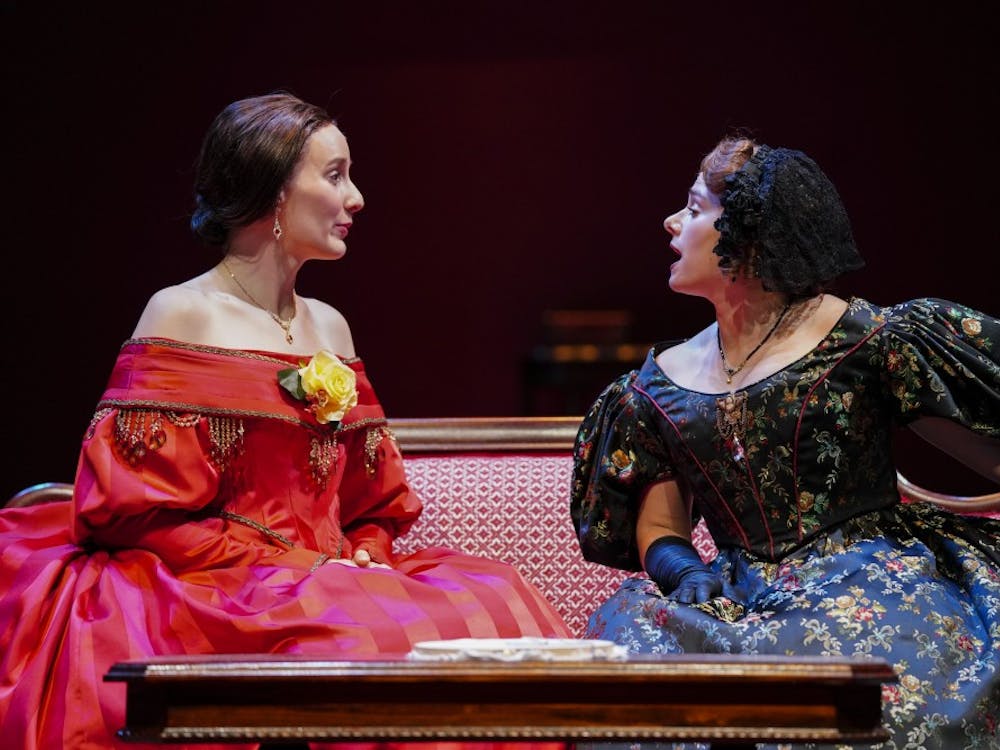 Catherine Sloper, left, and aunt Lavinia Penniman, right, portrayed by Glynnis Kunkel-Ruiz and Ellise Chase, socialize before a party during a rehearsal of Ruth and Augustus Goetz “The Heiress” on Sept. 18 in Ruth N. Halls Theatre. The story focuses on Catherine Sloper, a wealthy, socially awkward woman who falls in love with a man that her father believes is only after their money.
