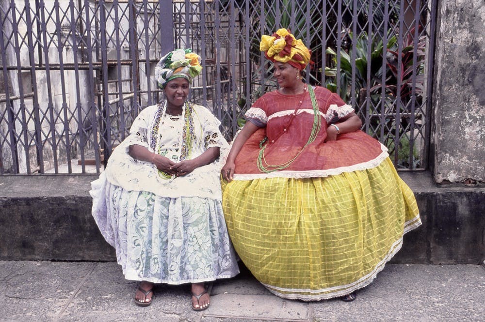 This photo taken in 2009 in Salvador, Bahia, Brazil, shows women wearing Baiana dress, which combines elements of African and European clothing. It is part of the Mathers Museum exhibit 'Costume: Performing Identities through Dress.'
