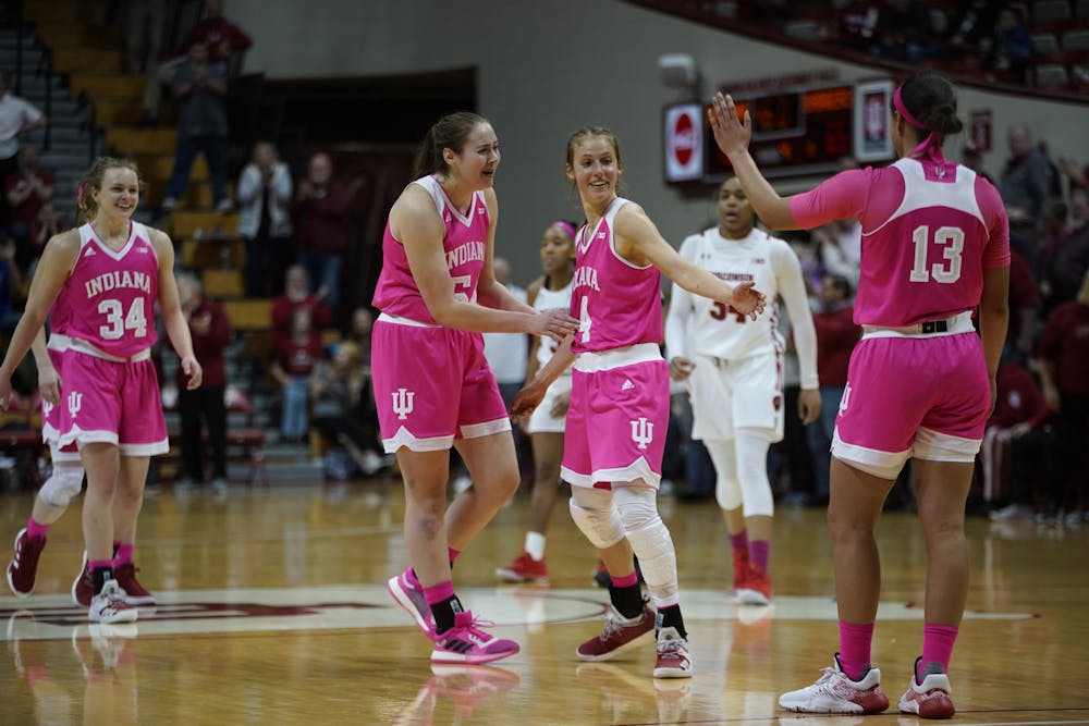 <p>Red shirt junior Ali Patberg is cheered on by her teammates after scoring a 3-pointer during the last minute of overtime Jan. 30 at Simon Skjodt Assembly Hall. Patberg scored 20 of IU’s 75 points.</p>