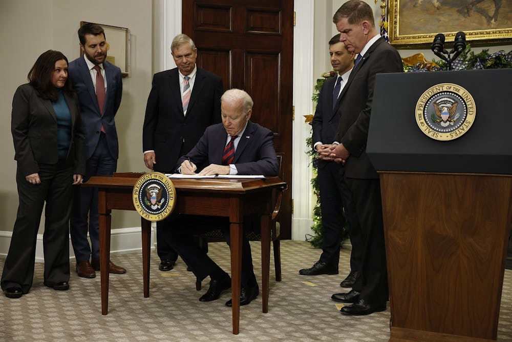 <p>President Joe Biden signs bipartisan legislation averting a rail worker strike Dec. 2, 2022, in the Roosevelt Room at the White House. </p>
