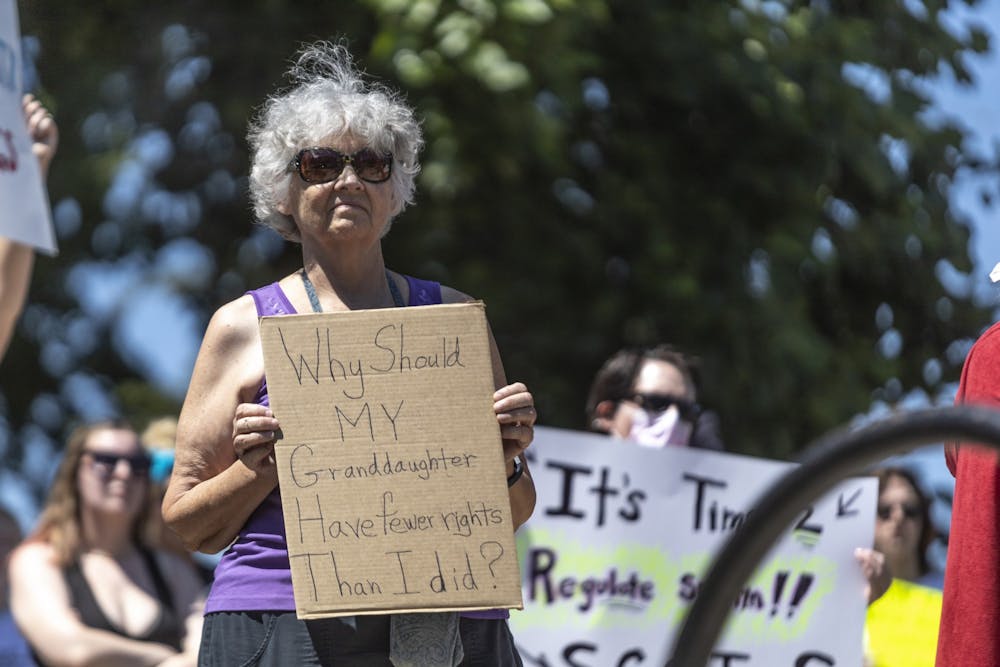 <p>A woman holds up sign that reads, &quot;Why should my granddaughter have fewer rights than I did?&quot; June 27, 2022, in front of the Monroe County Courthouse during a protest for reproductive rights following the Supreme Court&#x27;s decision to overturn Roe v. Wade.</p>