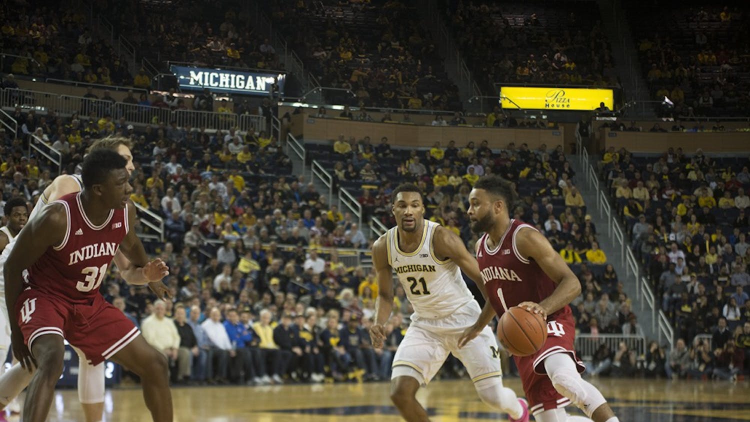 Junior guard James Blackmon Jr. drives to the basket during IU's loss to Michigan on Thursday. Blackmon scored just 4 points in the loss and will be out indefinitely after an injury sustained during the game.