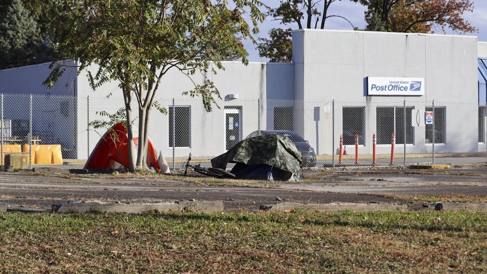 An unhoused camp is seen Oct. 18, 2022, outside the United States Postal Office on South Walnut Street. Homelessness is a policy choice that can be fixed.