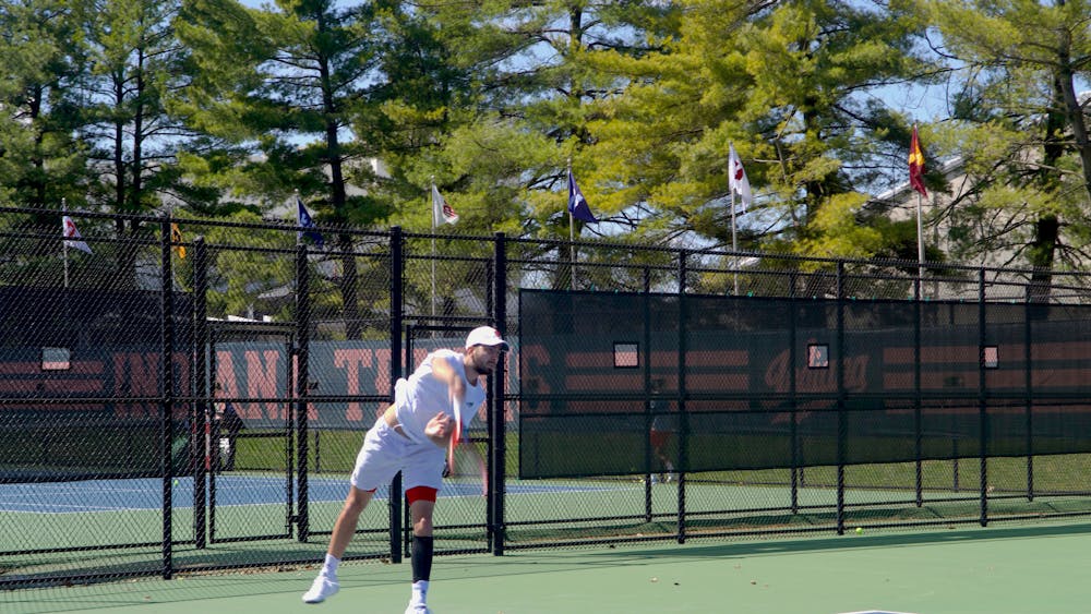 Senior Luka Vukovic serves in a singles match April 2, 2023, at the IU Tennis Court. Indiana lost to Nebraska and Wisconsin this weekend.