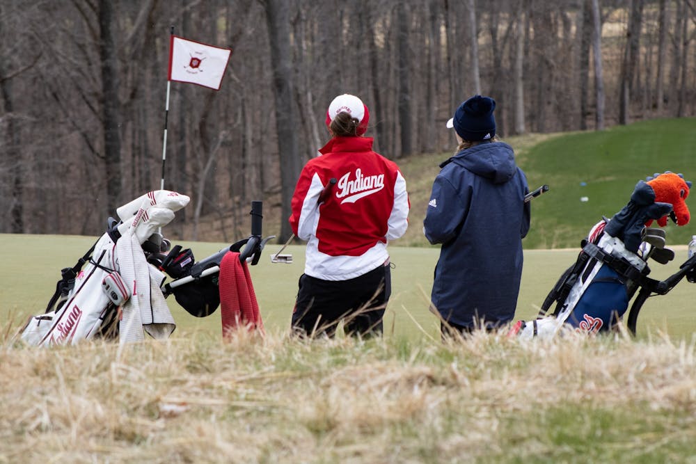 <p>Then-senior Maddie Dittoe chats with her opponent during the IU Invitational on April 9, 2022. The team hired Brian May as the new head coach.</p>