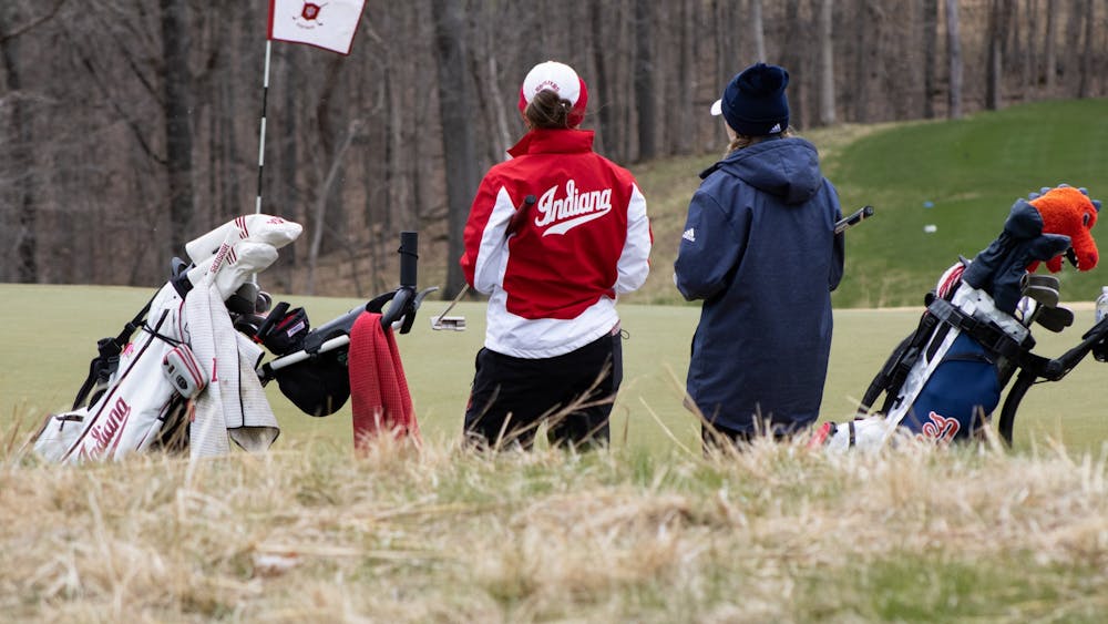Then-senior Maddie Dittoe chats with her opponent during the IU Invitational on April 9, 2022. The team hired Brian May as the new head coach.