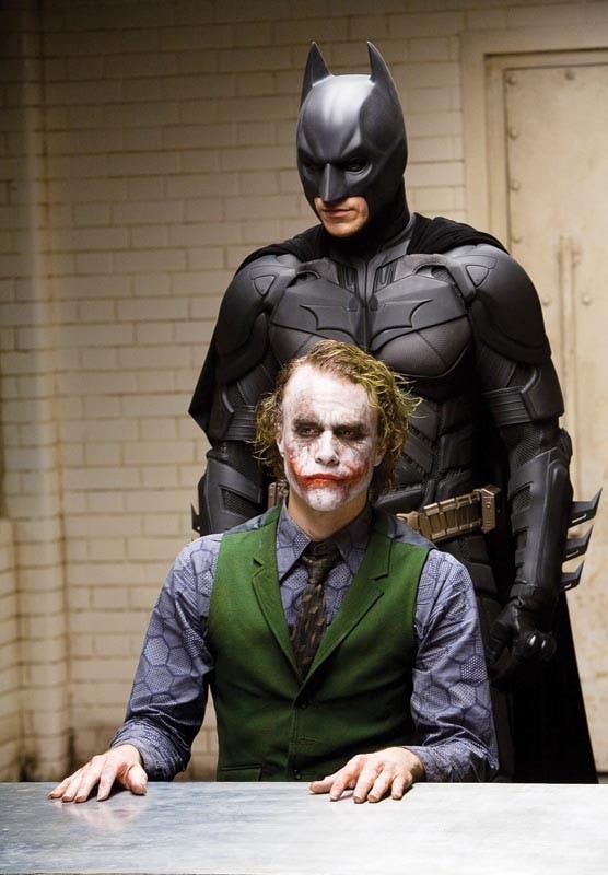 In this image released by Warner Bros., Heath Ledger starring as The Joker, is shown in a scene with Christian Bale, starring as Batman in "The Dark Knight." (AP Photo/Warner Bros. Pictures, Stephen Vaughan) ** NO SALES **