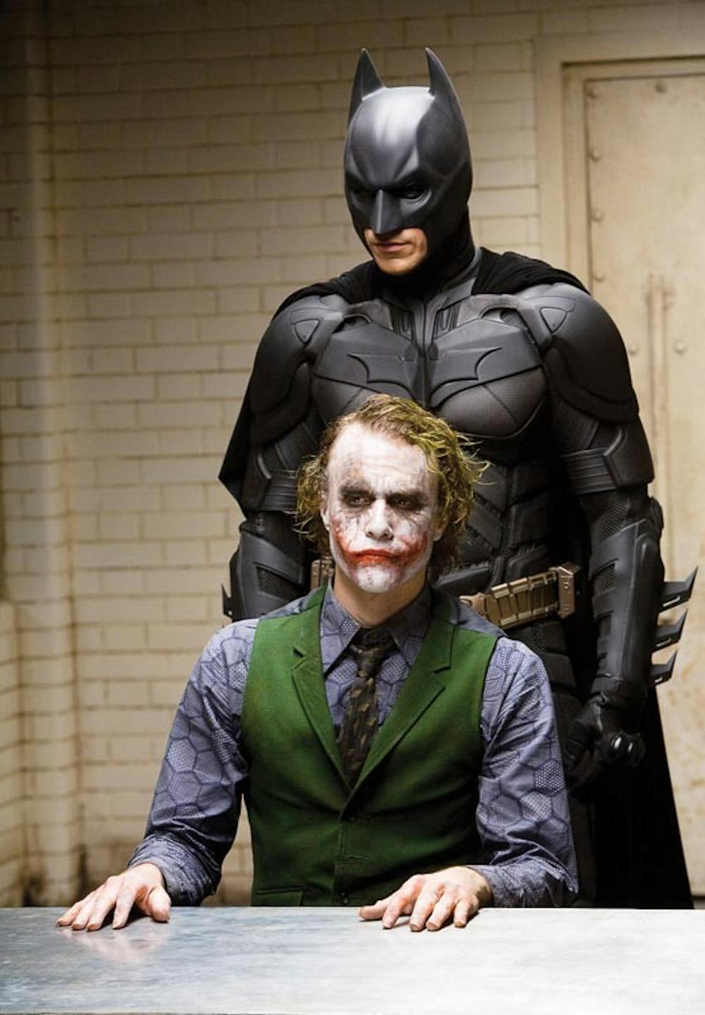 In this image released by Warner Bros., Heath Ledger starring as The Joker, is shown in a scene with Christian Bale, starring as Batman in "The Dark Knight." (AP Photo/Warner Bros. Pictures, Stephen Vaughan) ** NO SALES **