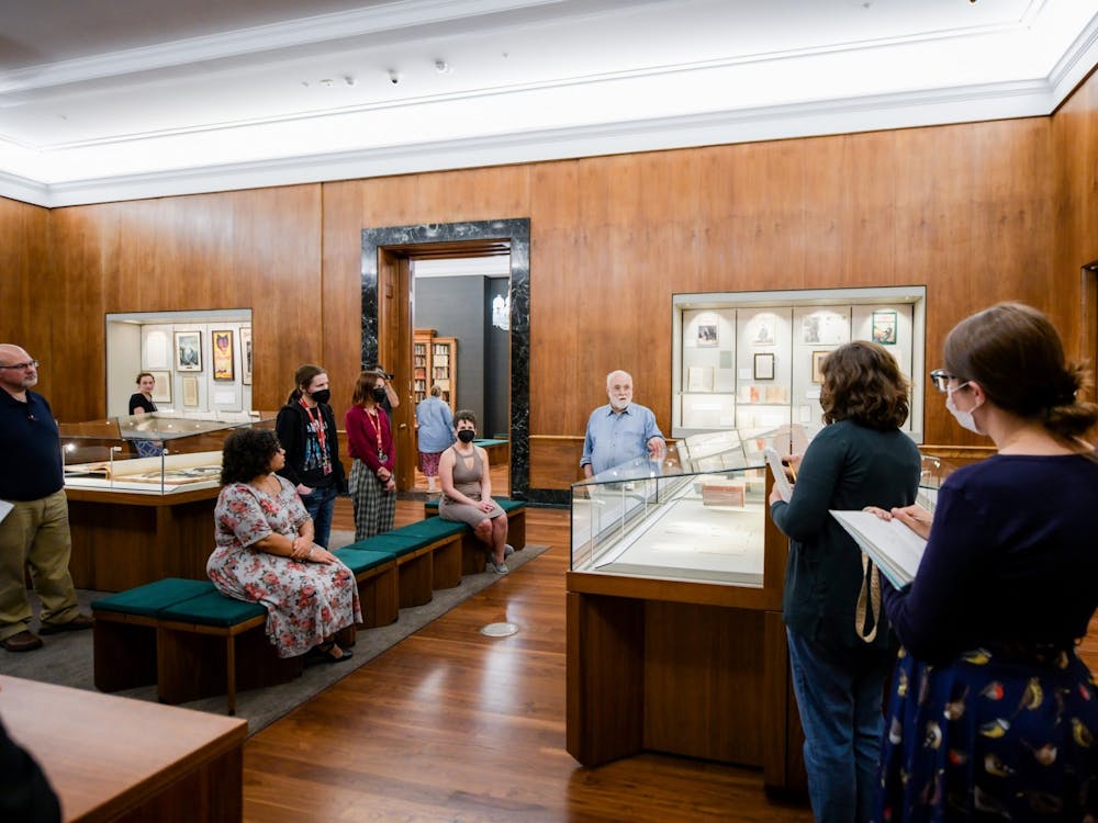 Glen Miranker leads a staff tour of the &quot;Sherlock Holmes in 221 Objects&quot; exhibit in the Lilly Library. Miranker is the collector behind the exhibit.