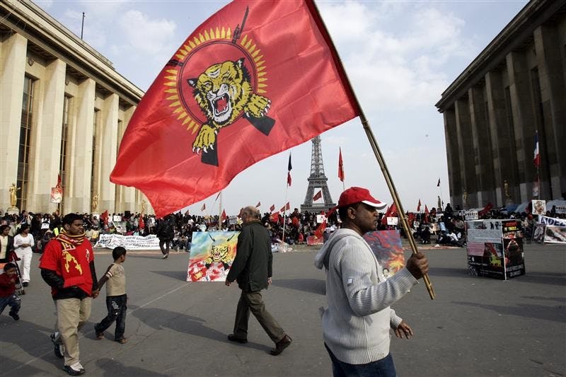 Pro-Tamil demonstrators gather at Trocadero Plaza near the Eiffel Tower in Paris Wednesday, during a protest. Britain and France said Wednesday they're pressing for more international help for civilians fleeing Sri Lanka's civil war which may include sending boats for an evacuation mission. French Foreign Minister Bernard Kouchner said action was needed to avert a desperate situation as people try to escape the Sri Lankan government's push against Tamil Tiger rebels.