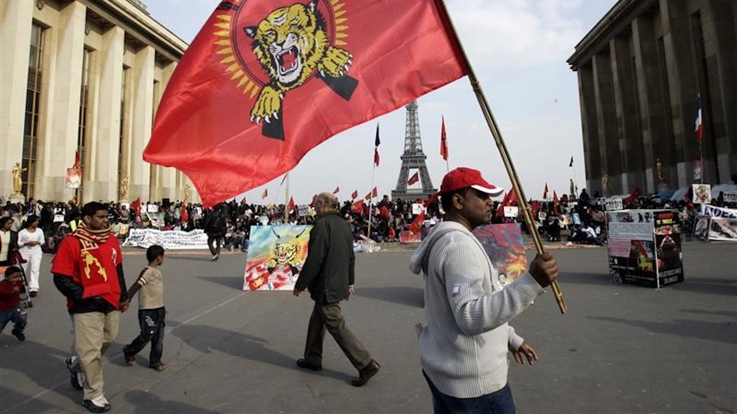 Pro-Tamil demonstrators gather at Trocadero Plaza near the Eiffel Tower in Paris Wednesday, during a protest. Britain and France said Wednesday they're pressing for more international help for civilians fleeing Sri Lanka's civil war which may include sending boats for an evacuation mission. French Foreign Minister Bernard Kouchner said action was needed to avert a desperate situation as people try to escape the Sri Lankan government's push against Tamil Tiger rebels.