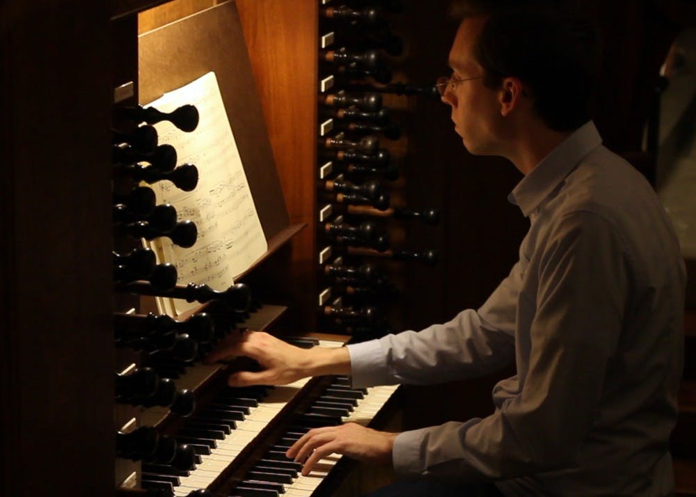 Lucas Fletcher, a doctoral music student, plays a piece on the historic Ehrlich organ Tuesday night. Located in the Indiana Memorial Union's Alumni Hall, the organ is one of the most used public instruments on IU's campus.