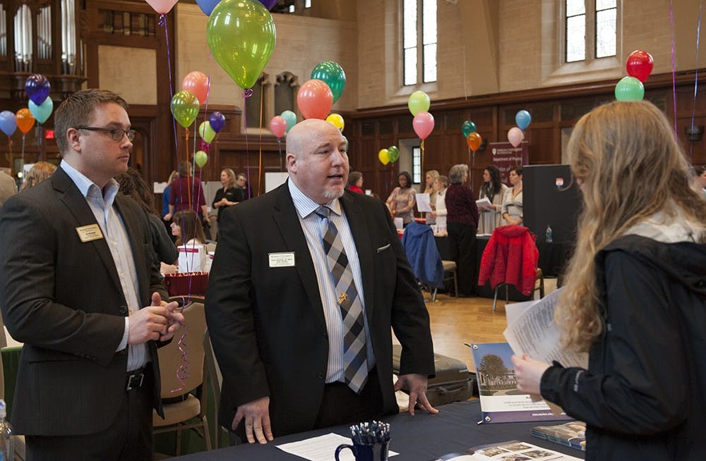 Dan Kellenberger (left), Assistant Director Marketing, Recruitment and Admissions and Dr. Patrick Woodman, DO (right) of Marian University speaking to one of the attendees of the Health Programs Fair held on Tuesday at the Alumni Hall in the IMU