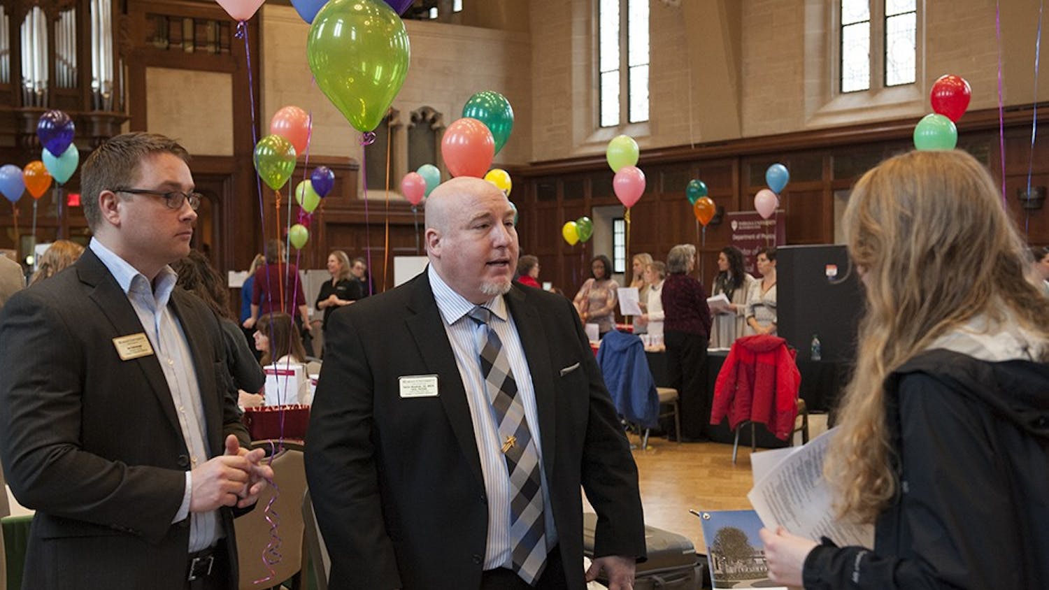 Dan Kellenberger (left), Assistant Director Marketing, Recruitment and Admissions and Dr. Patrick Woodman, DO (right) of Marian University speaking to one of the attendees of the Health Programs Fair held on Tuesday at the Alumni Hall in the IMU