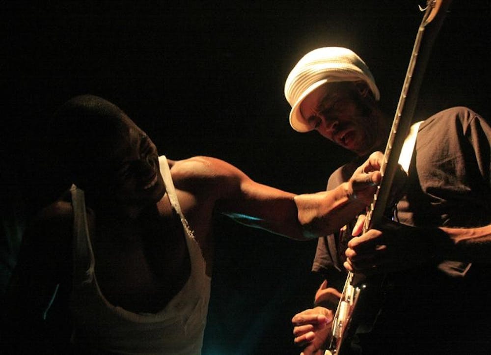 Hip-hop artist David Banner plays with a band member's guitar during the Hip Hop Live Tour with rappers Little Brother and Talib Kweli on Monday night at the Bluebird Nightclub.