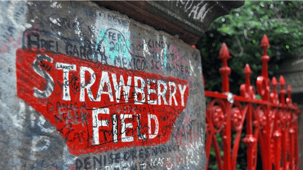 Fans' notes and signatures adorn the fence to the Salvation Army's Strawberry Field Community Home on June 11 on Beaconsfield Road in Liverpool. The former children's home closed its doors in 2005 and is now a church and prayer center.