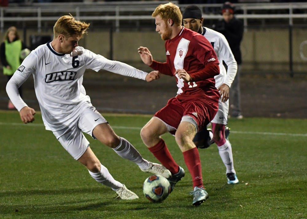 Junior midfielder Cory Thomas fights for the ball against New Hampshire in the third round of the NCAA tournament Saturday evening at Bill Armstrong Stadium. Thomas scored one goal in IU's 2-1 win against New Hampshire.