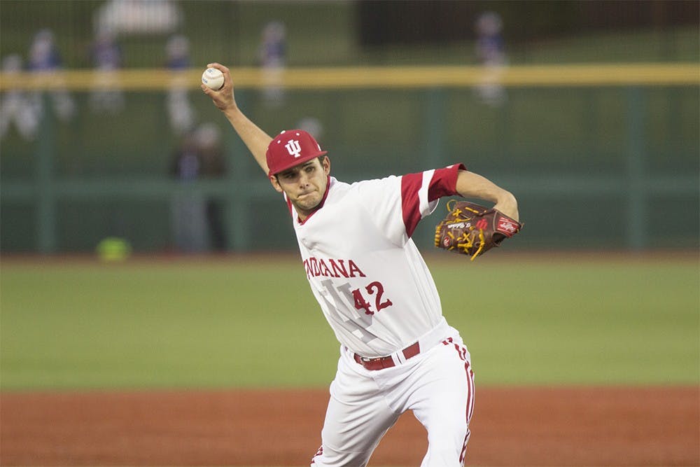 Junior right-handed pitcher Thomas Belcher attempts to strike out a Ball State hitter on Wednesday night at Bart Kaufman field. IU beat Ball State 4-3.