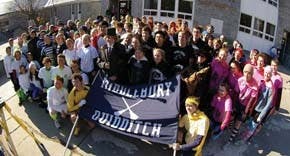 the 12 teams, commissioner, and snitches gather under the banner before marching to the field.
