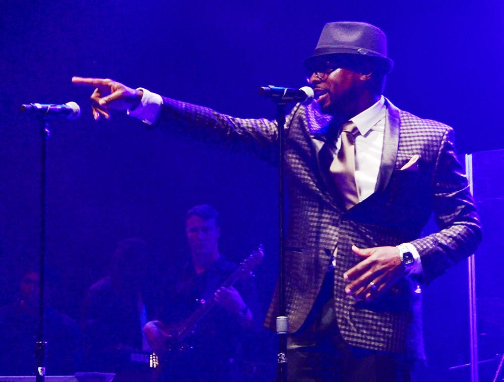 Tyron Cooper, director of the IU Soul Revue, talks with audiences during the spring concert of the IU Soul Revue Saturday at Buskirk-Chumley Theatre. 