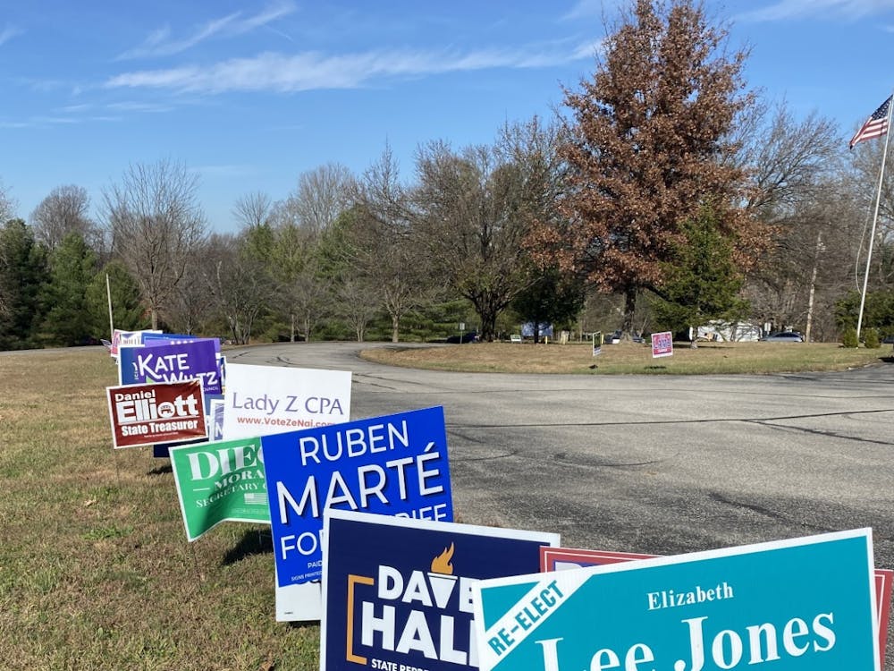 Yard signs supporting various candidates are seen lined up at the edge of the parking lot Nov. 8, 2022, at Southside Christian Church. There was a heavy flow of voters at the church throughout the day.