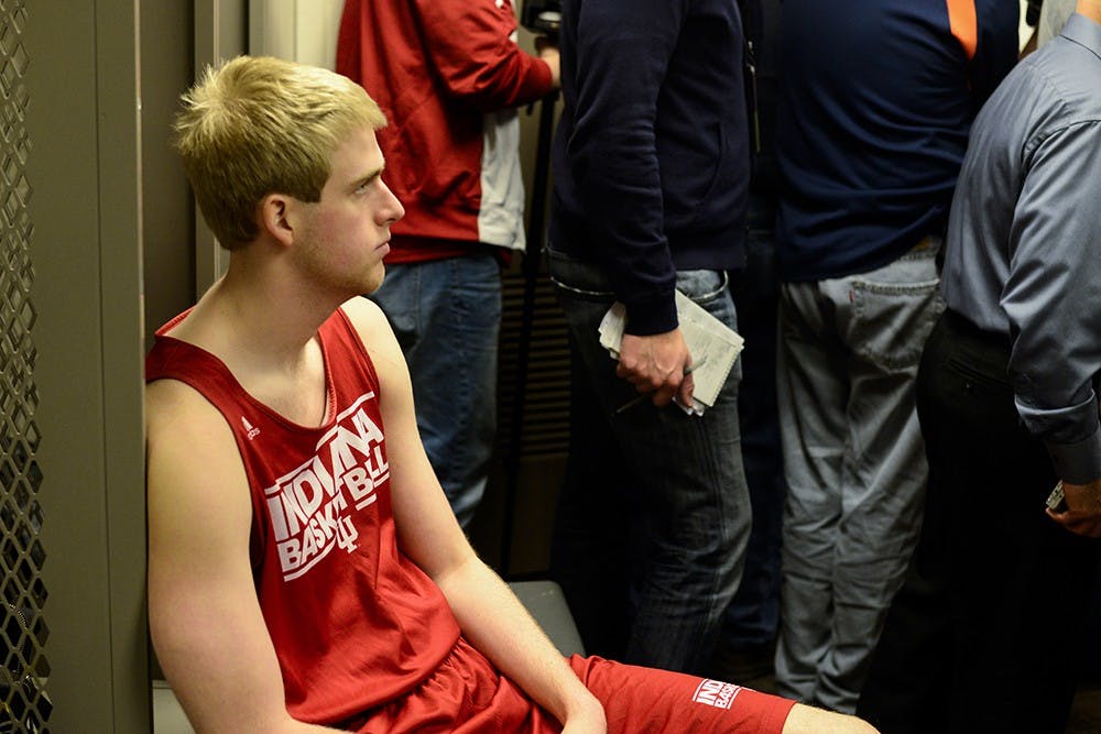 Freshman Tim Priller waits for media to interview him in the locker room Thursday at the CenturyLink Center in Omaha, Neb.