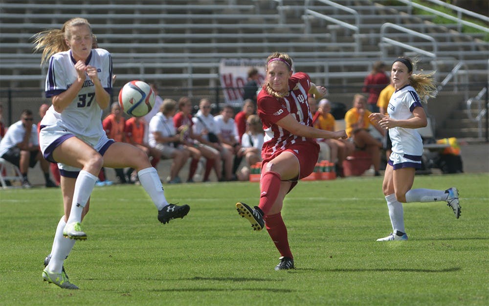 Red shirt junior midfielder Kayleigh Steigerwalt strikes the ball during the game against Northwestern University at Bill Armstrong Stadium. IU tied the game 1-1. 
