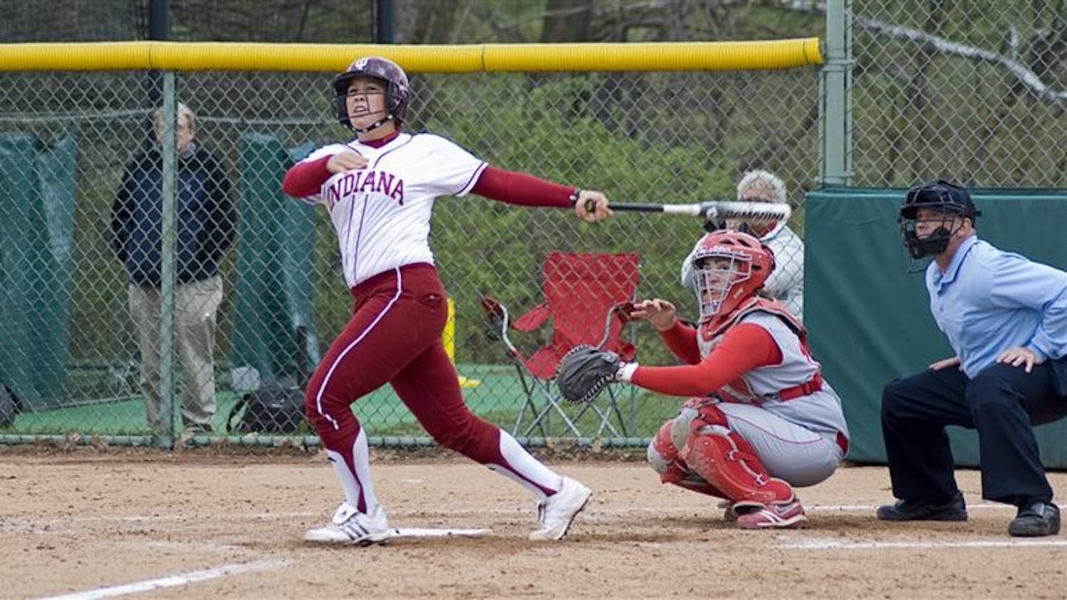 Sophomore pitcher Sara Olson hits a foul ball during the first game of a double-header against Ohio State on Wednesday afternoon at the IU Softball Field. Olson pitched a no-hitter in the second game.
