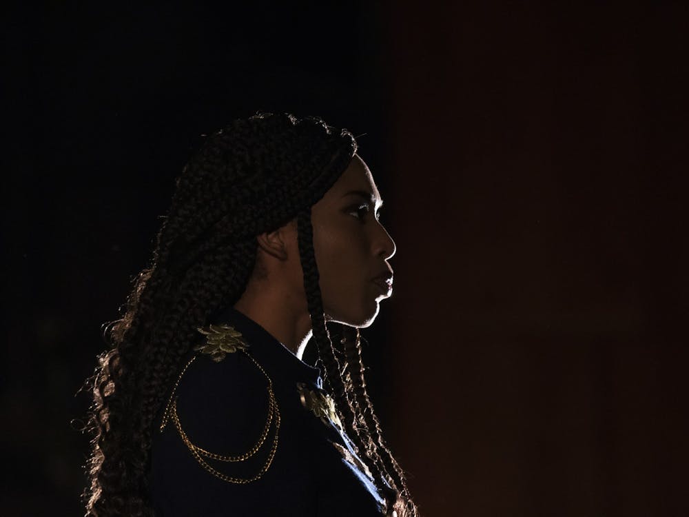 Actress Adrianne Embry looks out during the final scene of “Hamlet” on Dec. 3 in Ruth N. Halls Theater. Embry is a founding member of the group BBBTT, or Black Brown &amp; Beige Theater Troupe, whose goal is to promote the inclusion of people of color in the IU theater department.
