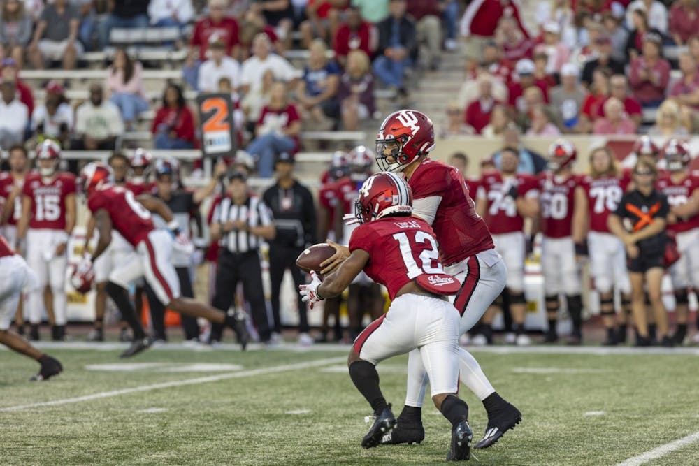 <p>Sophomore running back Jaylin Lucas receives a handoff from redshirt freshman quarterback Tayven Jackson on Sept. 8, 2023 at Memorial Stadium in Bloomington. Indiana will travel to Lucas Oil Stadium on Saturday to take on the University of Louisville.</p>
