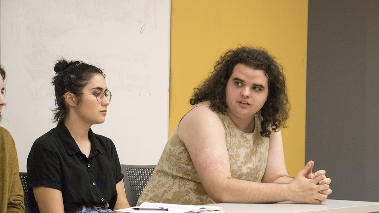 Bee Smale (right), a senior in Policy Analysis and Gender Studies, responds to a question as Anna Ortega (left), a sophomore in History and Folklore, listens. "If 100% of Congress were women, would catcalling still be a thing, would 1 in 5 women on college campuses still be raped?" Smale asked the room. 