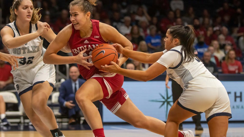IU senior forward Aleksa Gulbe drives against Butler University defenders on Nov. 10, 2021, at Hinkle Fieldhouse. Indiana women&#x27;s basketball lost its first game of the season against Stanford University on Thursday.