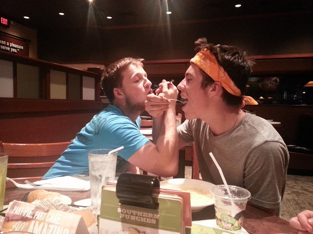 Anthony Wilkerson, left, and his brother Taylor goof around during a dinner at O'Charley's. Wilkerson passed away on Nov. 20 in his hometown of Indianapolis. 